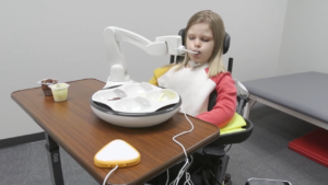 Consumer trialing Robotic Feeding Arm